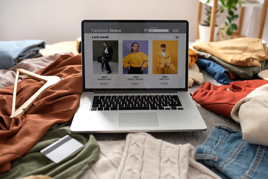 high-angle-clothes-bed-fast-fashion-concept